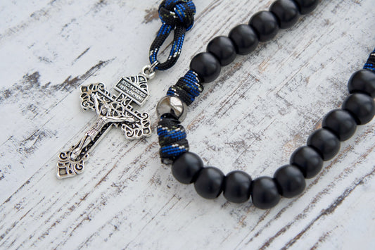 Embrace divine protection with our Thin Blue Line - 5 Decade Paracord Rosary, featuring premium unbreakable paracord rope, Hail Mary beads, Our Father beads, Pardon Crucifix, and devotional medal of St. Michael & Guardian Angel for Catholic gifts.