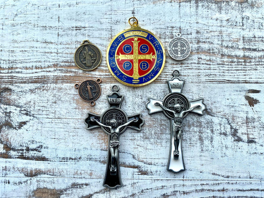 Several St. Benedict Medal options include enamel crucifixes, large medals, small medals and rosary centers.