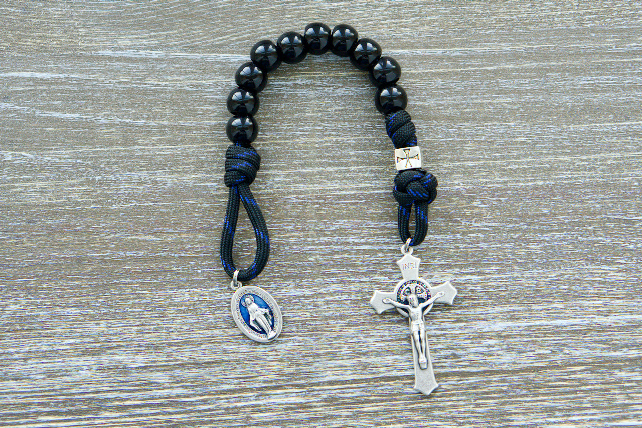 Pocket-sized handmade Single Decade Rosary by Sanctus Servo made with unbreakable premium paracord, perfect for praying on the go and easy to carry in a pocket, purse, or as a keychain for daily battle preparation.