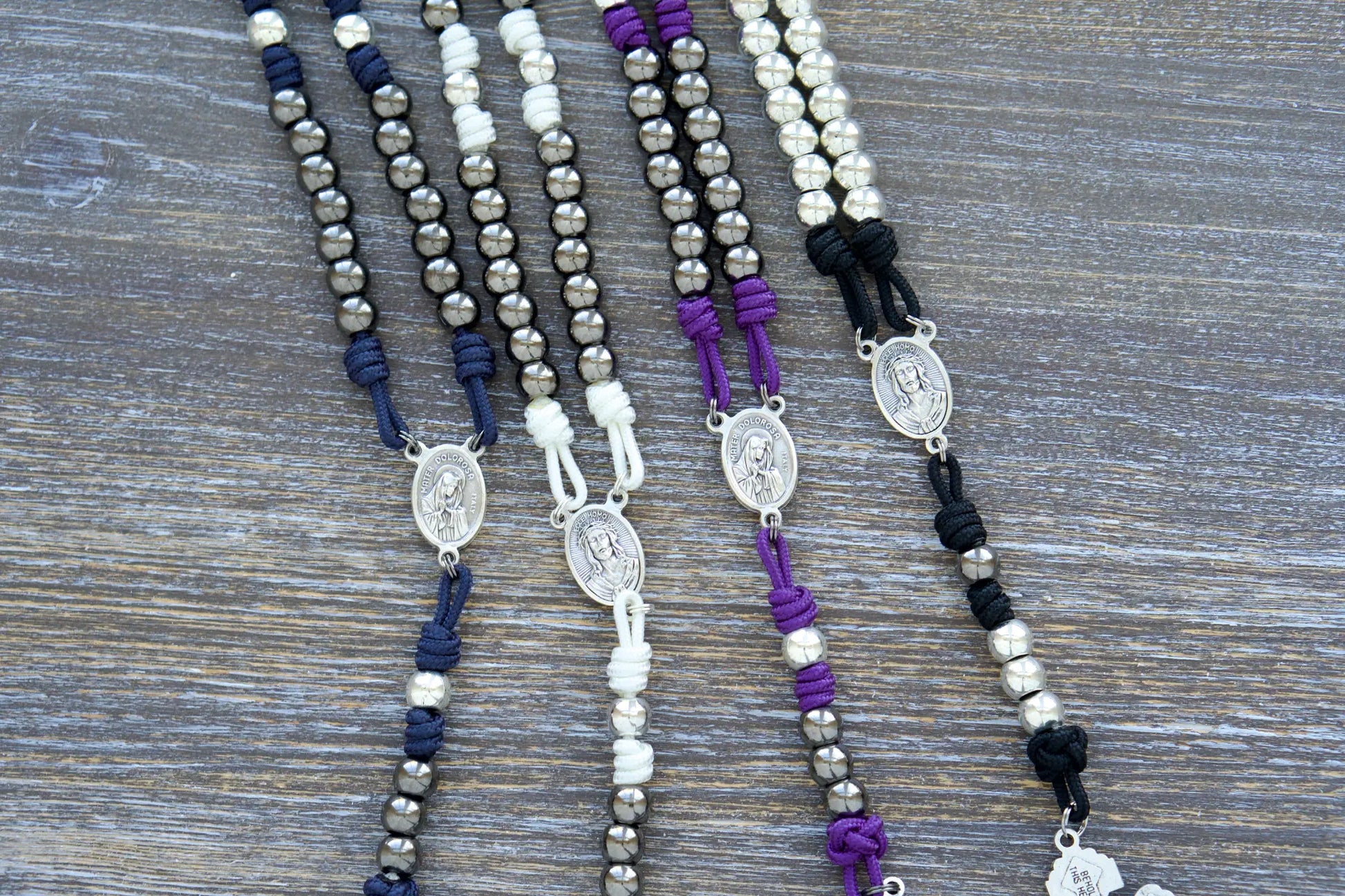 7 Sorrows Servite Rosary chaplet with gunmetal 10mm metal beads, Mater Dolorosa centerpiece, and 2" Triple Threat Pardon Crucifix in navy blue paracord.  