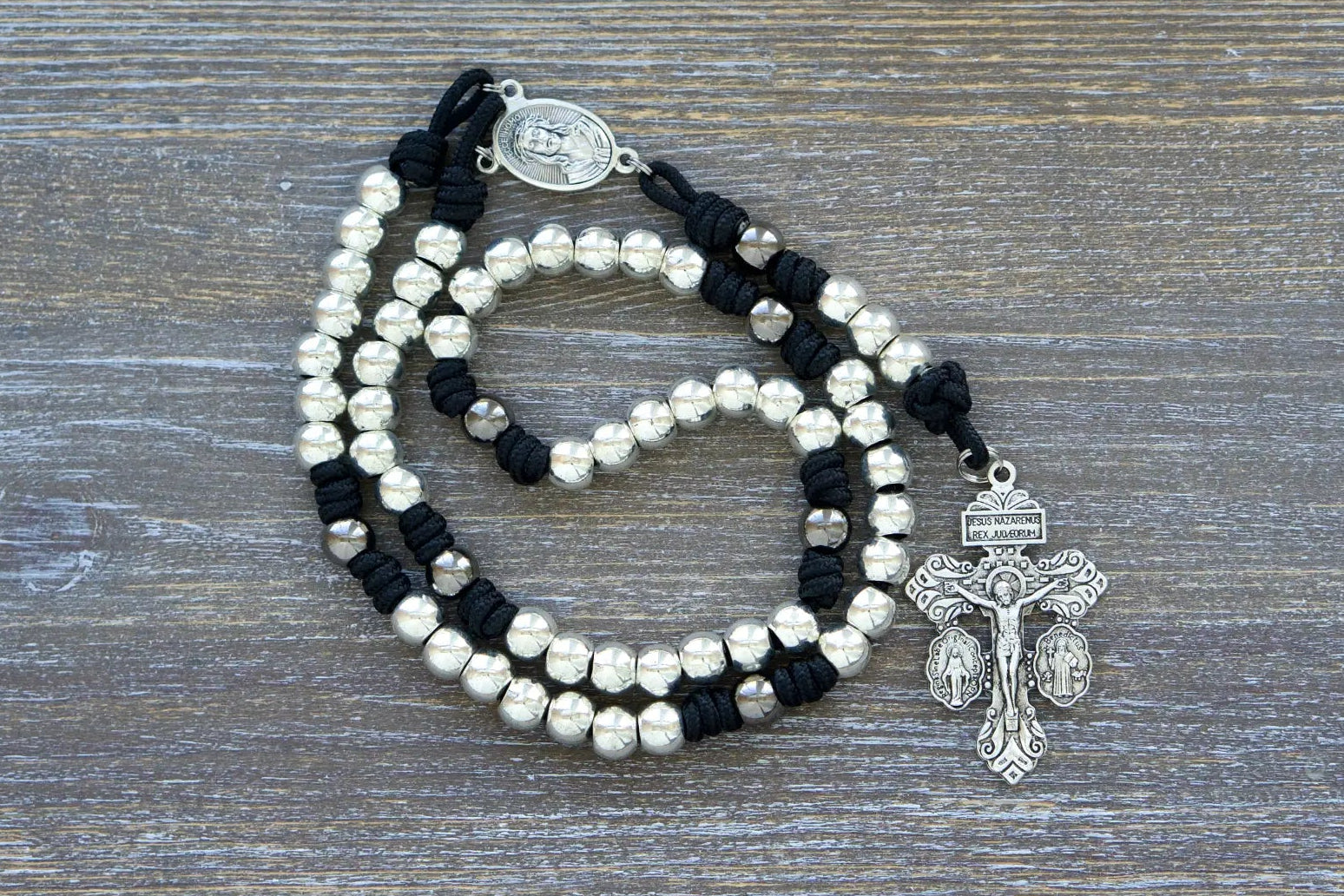 7 Sorrows Servite Rosary chaplet: silver alloy beads, Mater Dolorosa centerpiece, Triple Threat Pardon crucifix on midnight black paracord.