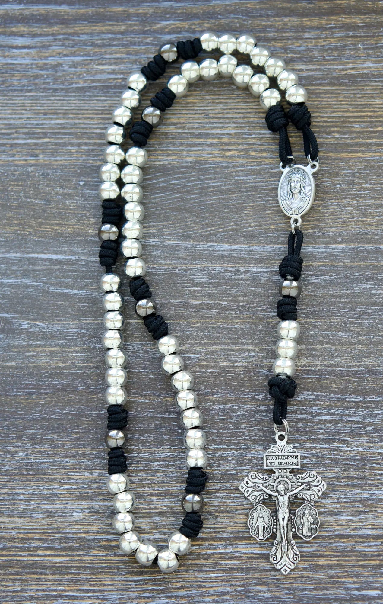 7 Sorrows Servite Rosary chaplet in midnight black paracord with silver 10mm beads, featuring a Mater Dolorosa centerpiece and 2" Triple Threat Pardon Crucifix.  
