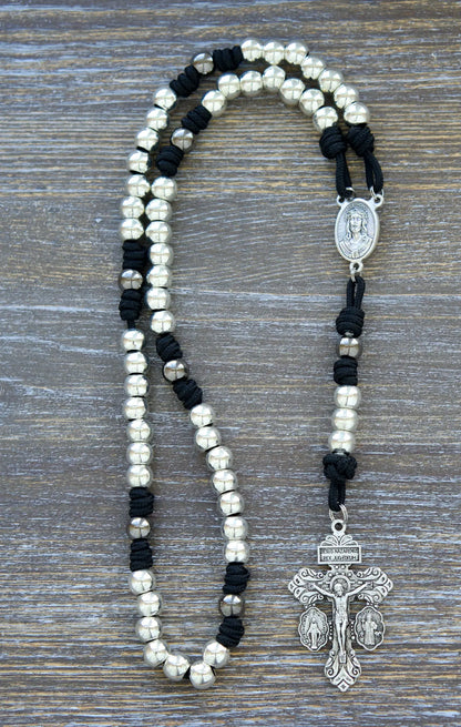 7 Sorrows Servite Rosary chaplet in midnight black paracord with silver 10mm beads, featuring a Mater Dolorosa centerpiece and 2" Triple Threat Pardon Crucifix.  