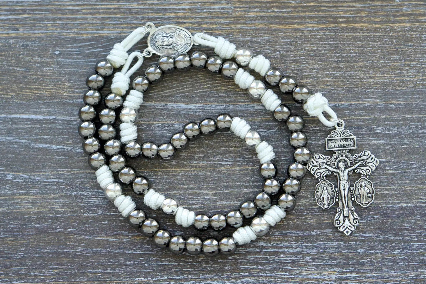 Premium metal rosary chaplet with white, black, navy blue and purple rope options, featuring Mater Dolorosa design.
