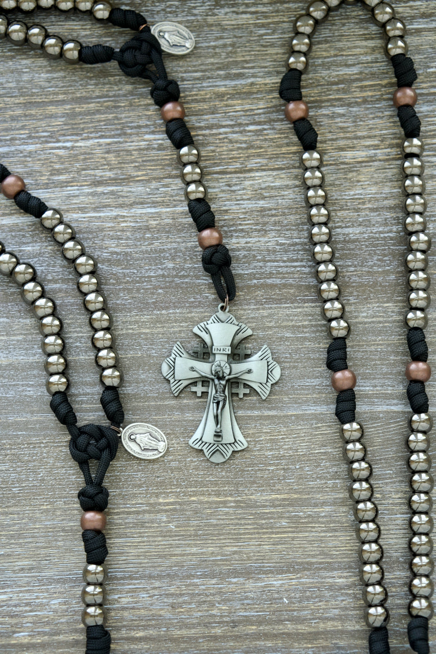 Ancient Armor - 5 Decade Paracord Rosary: Durable, Premium Quality Catholic Combat Accessory with Large Gunmetal Beads, Antique Copper Our Father Beads, and Black Paracord. Empower Your Prayers with the Jerusalem Cross, Miraculous Medal Devotional Medal, and 3-inch Crucifix.