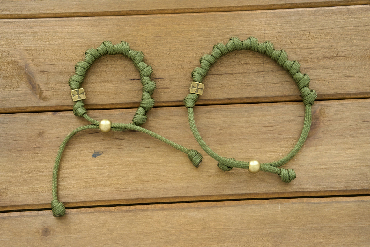 Handcrafted Army Green Olive Knotted Rosary Bracelet for durable spiritual support, featuring adjustable size and olive-colored beads. Perfect for active Catholics in need of unbreakable prayer companions.