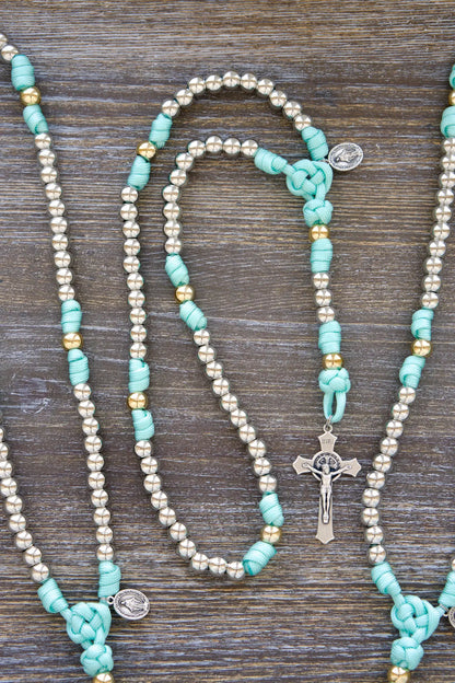 Paracord rosary with St. Benedict charm and Miraculous Medal, teal blue & gold accents, empowering gift for youth.