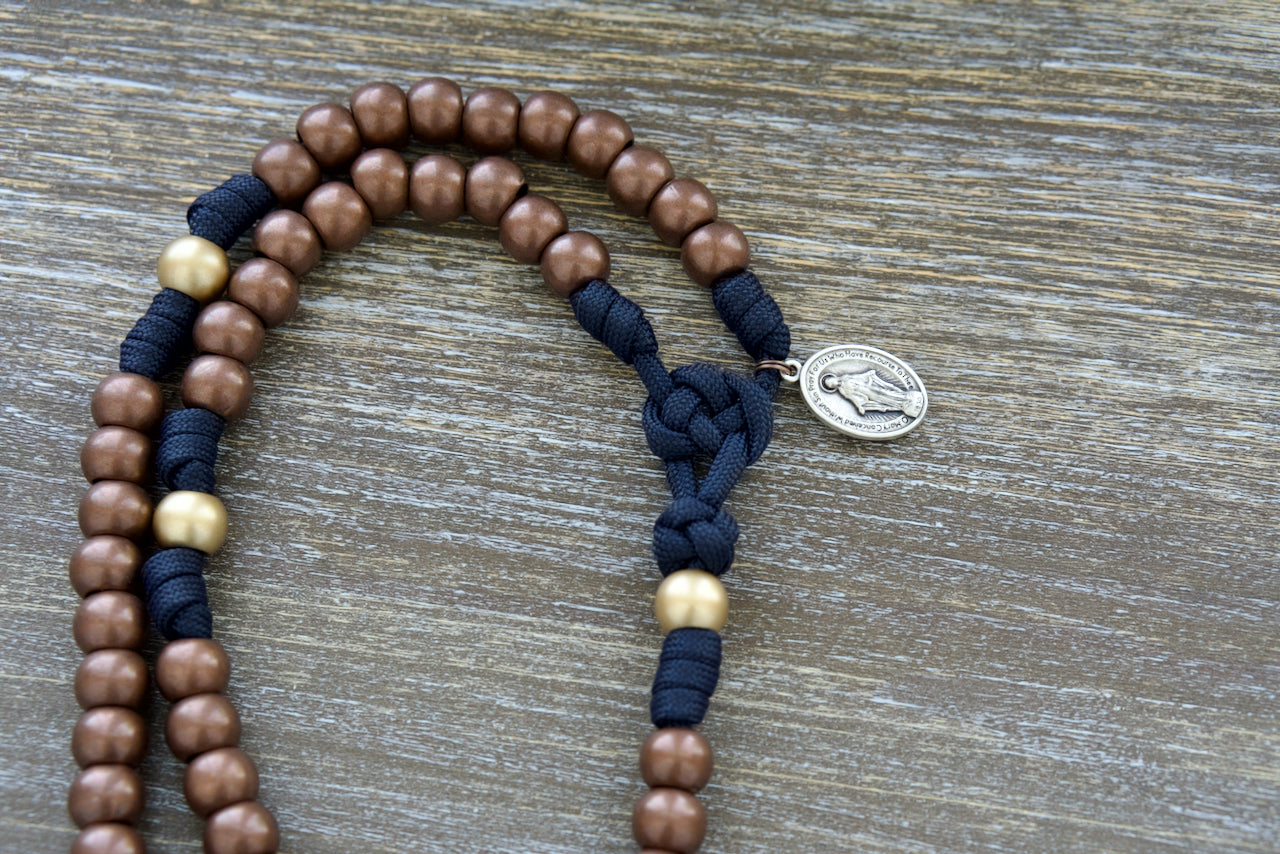 Blessed Be God - 5 Decade Premium Unbreakable Navy Blue and Antique Copper Paracord Rosary with 12mm Beads, 2-inch Copper Pardon Crucifix, and Miraculous Medal. Catholic Gift for Adults by Sanctus Servo.