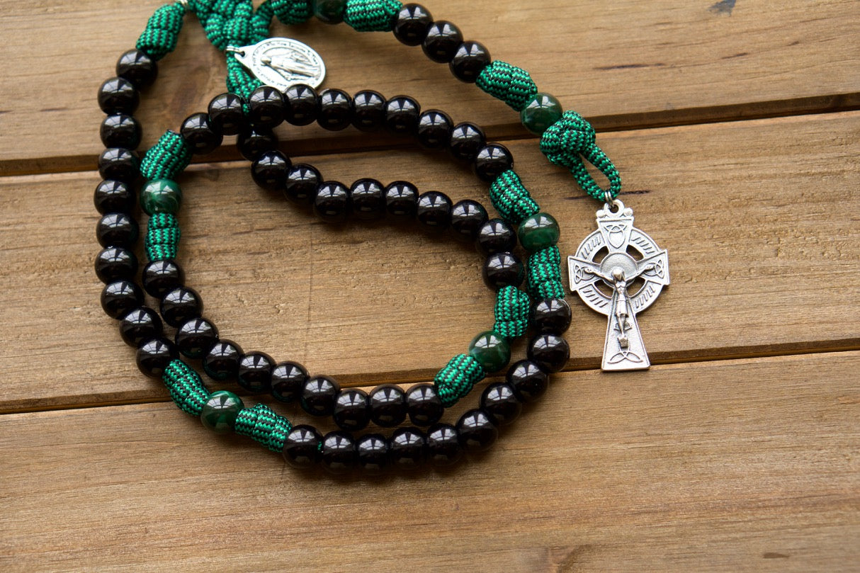 The Blessed Trinity - Irish Green and Black Paracord Rosary featuring St. Patrick & St. Bridget, with an Irish Trinity crucifix and Miraculous Medal for added devotion.