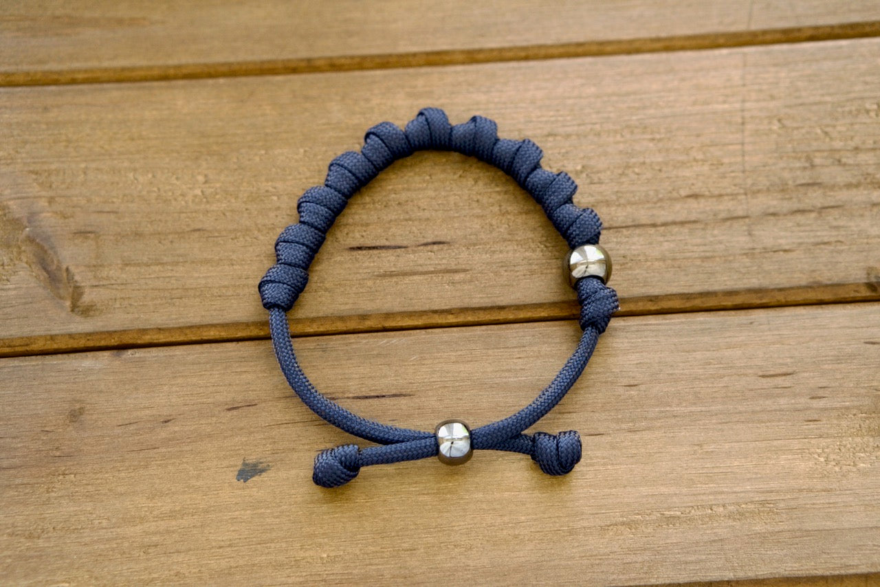 Navy Blue and Gunmetal Rosary Bracelet - Durable Paracord, Adjustable Design, and Elegant Gunmetal Beads for Prayer on-the-Go. Perfect for Strengthening Faith and Accompanying You Through Life's Battles.