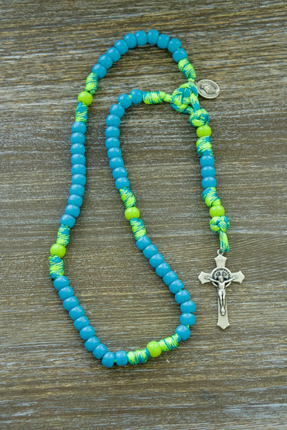 Kid's Paracord Rosary 'David's Slingshot': A durable, premium unbreakable rosary for young Catholics with vibrant sky blue and lime green beads, featuring a St. Benedict crucifix and Miraculous Medal.