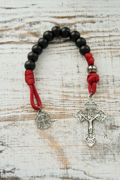 Introducing the Defender of Faith - Maroon and Black 1 Decade Paracord Rosary, an unbreakable Catholic gift that empowers you to defend your faith against any obstacle with its premium design featuring gunmetal Our Father beads.