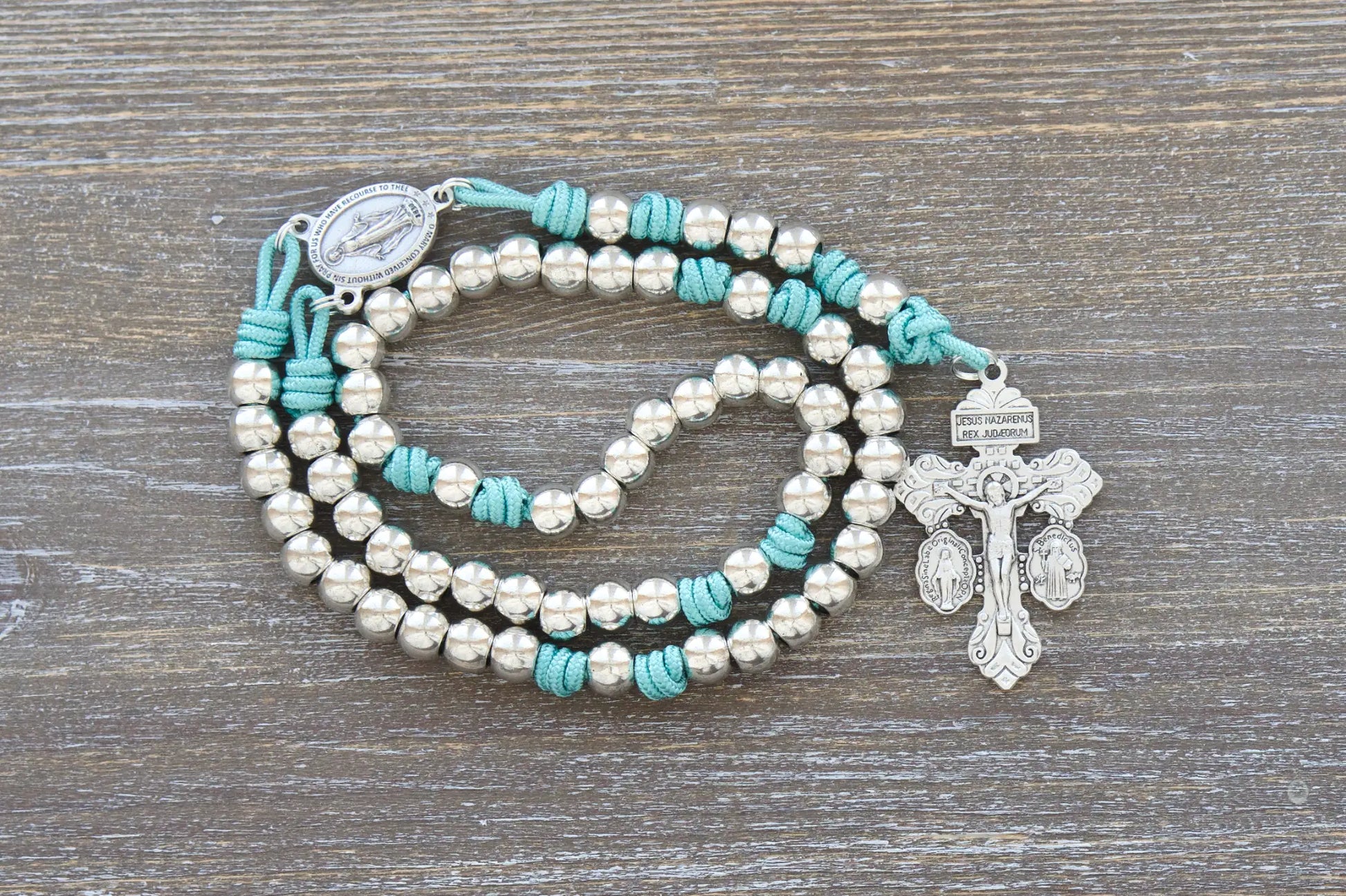 Divine Elegance premium metal paracord rosary in teal, white, pink, or purple with shiny silver beads and paracord 275.