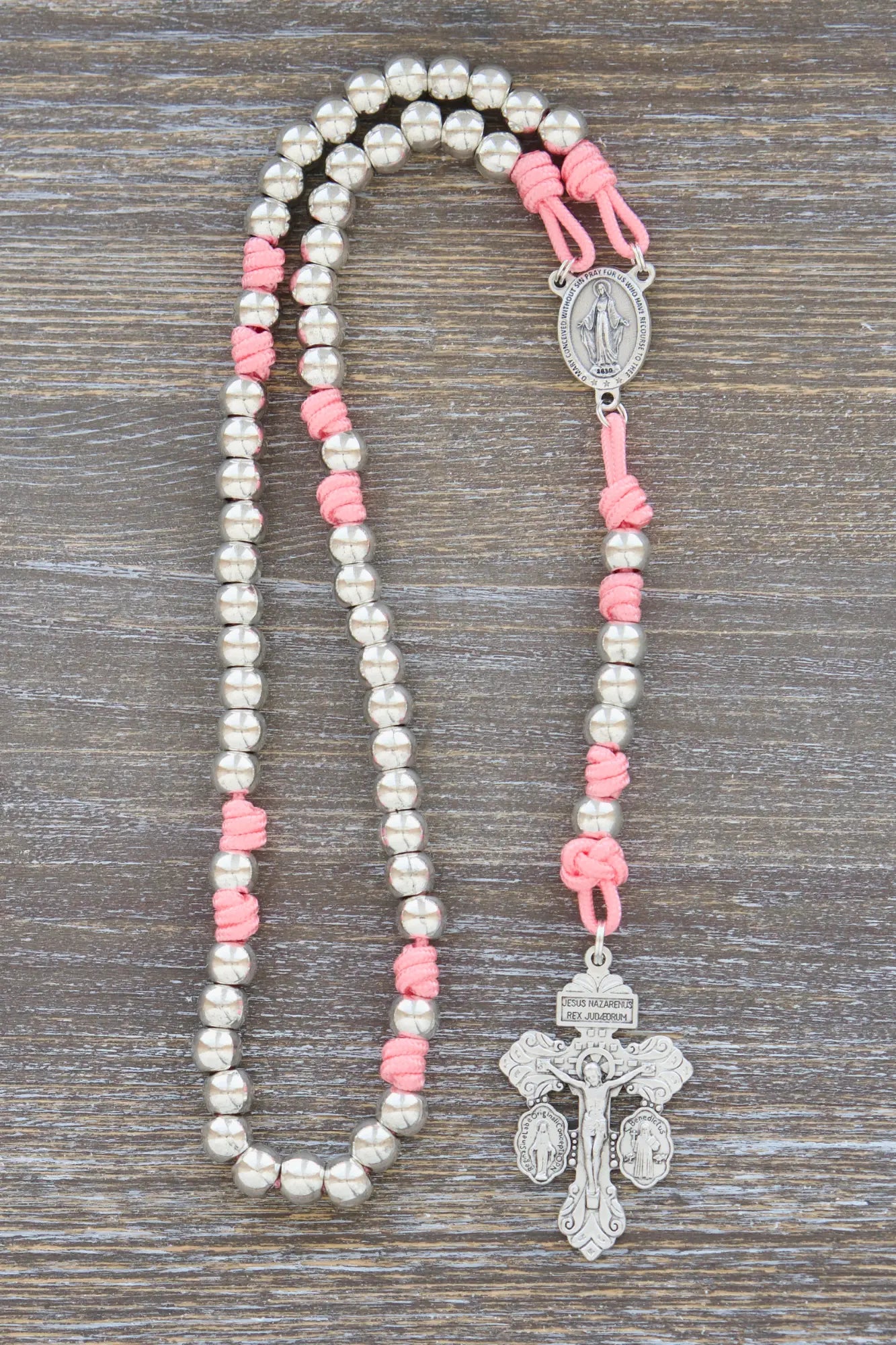 Divine Elegance premium metal paracord rosary with pink accents, shiny silver beads, and durable paracord 275.