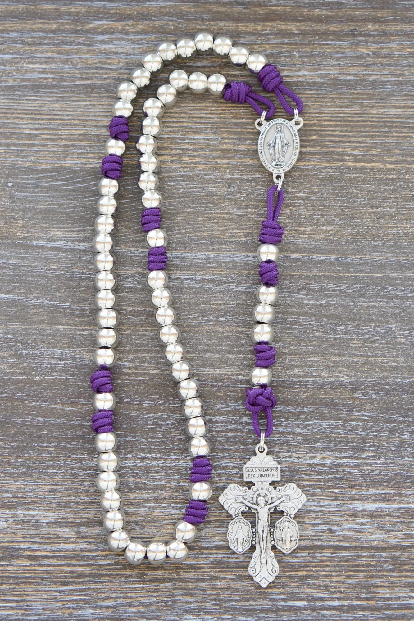Divine Elegance premium metal paracord rosary featuring purple rope, shiny silver beads, and rugged paracord 275.