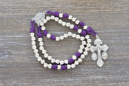 Divine Elegance premium metal paracord rosary with purple rope, shiny silver beads, and durable paracord 275.