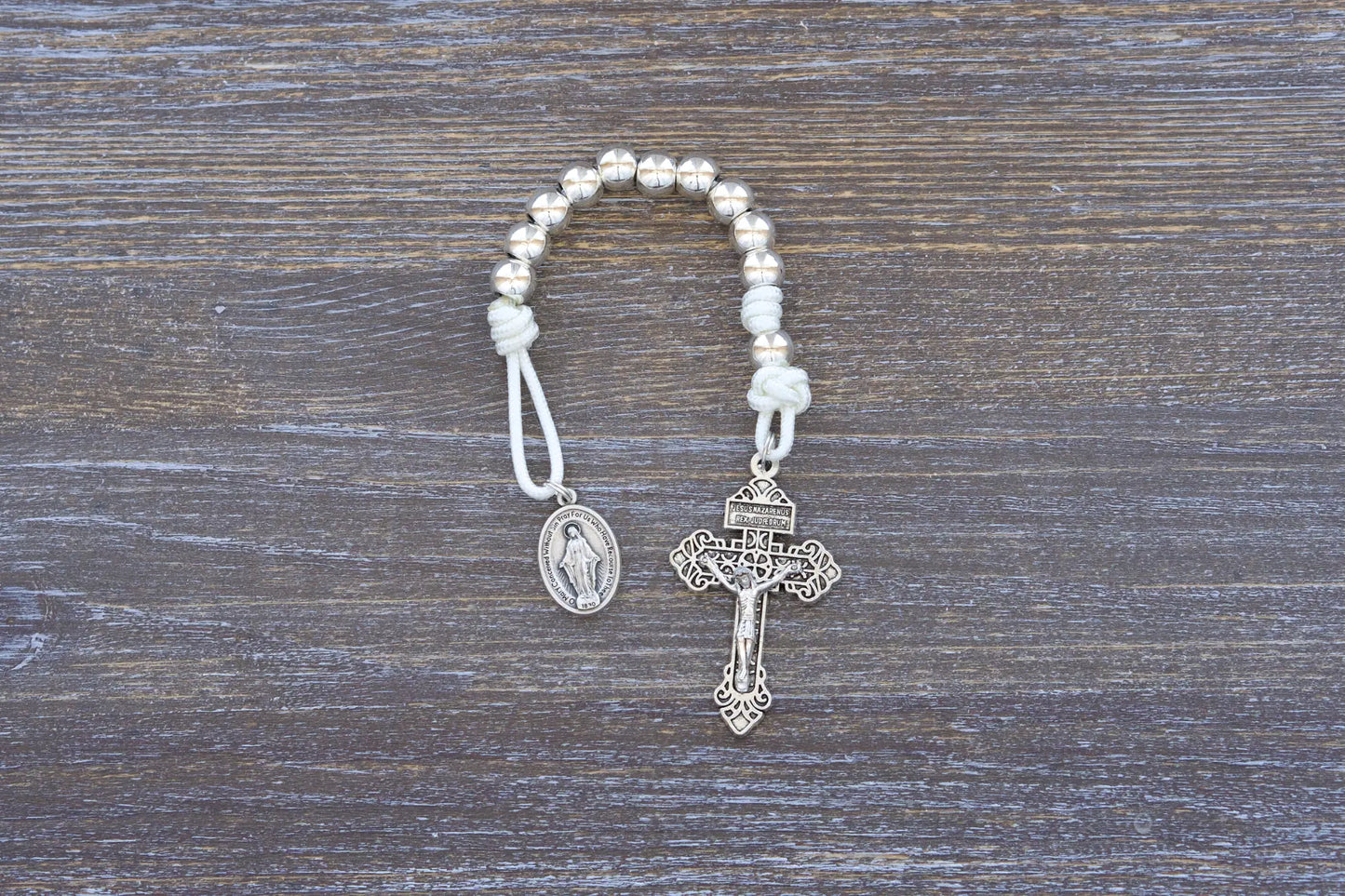Divine Elegance premium metal paracord rosary with silver beads, crucifix, and medal in 4 vibrant colors.
