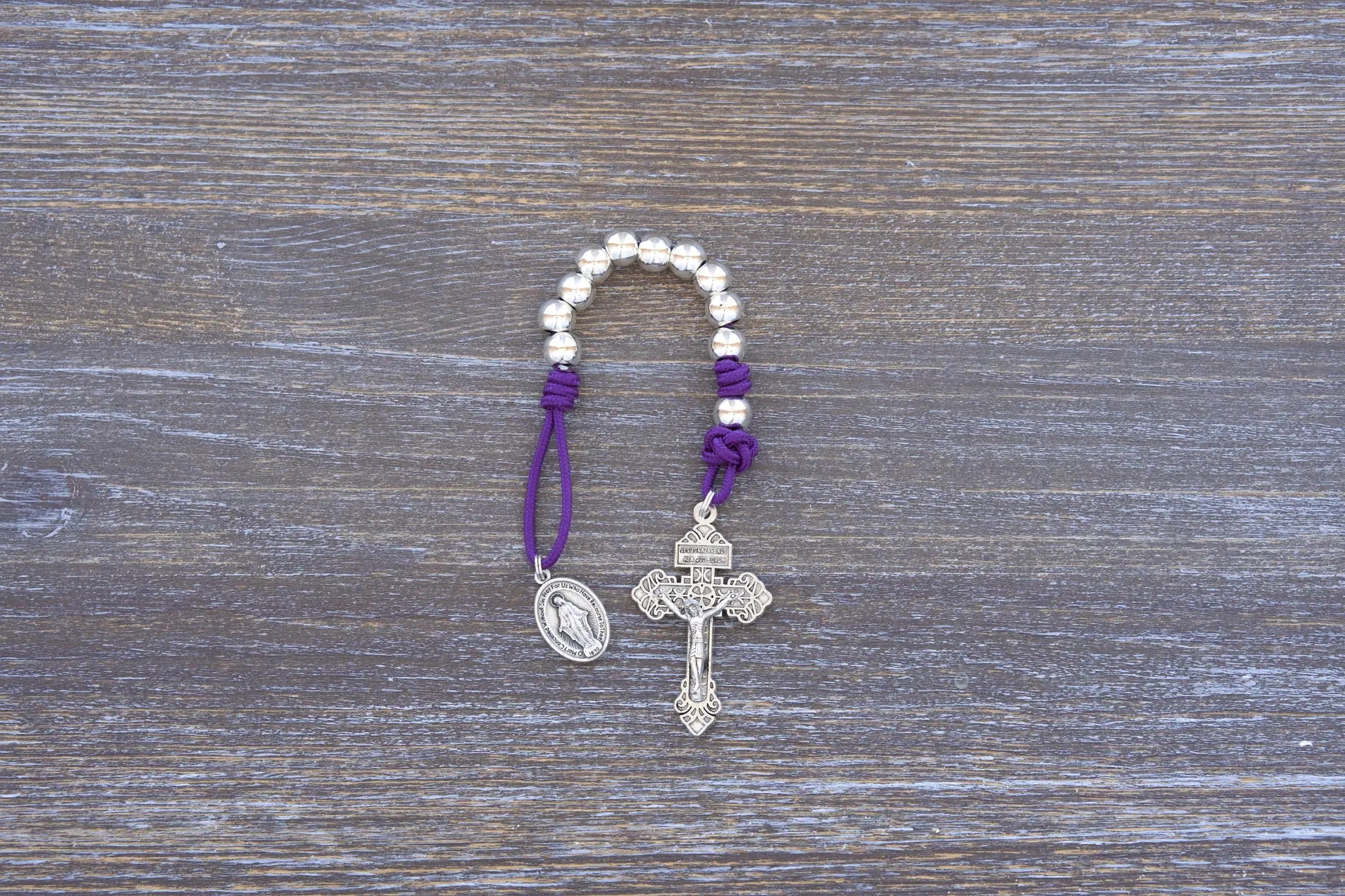 Divine Elegance premium metal paracord rosary with silver beads, crucifix, and medal in 4 vibrant colors.