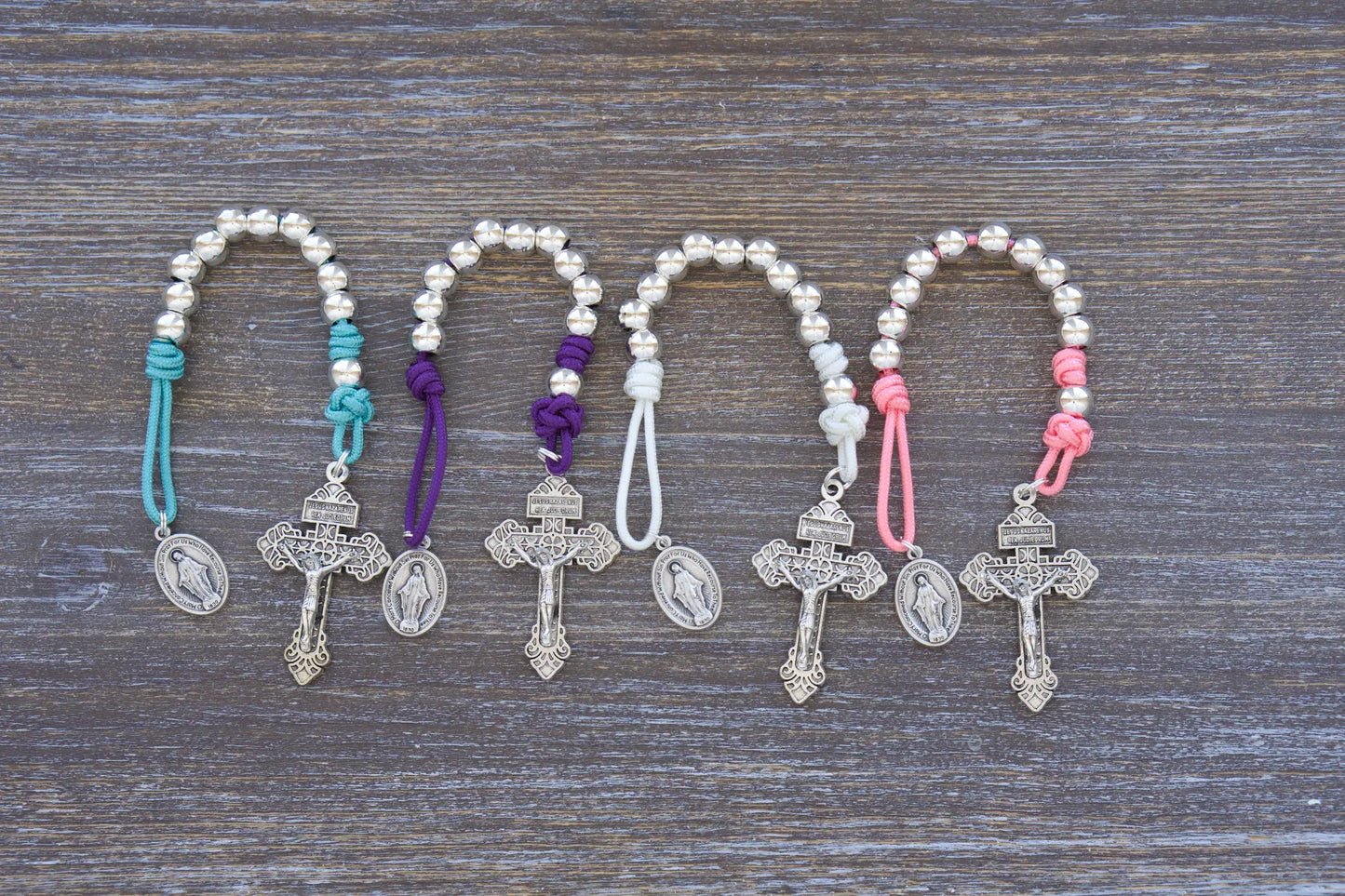 Divine Elegance pocket paracord rosary with silver metal beads, pardon crucifix and miraculous medal, available in 4 colors.