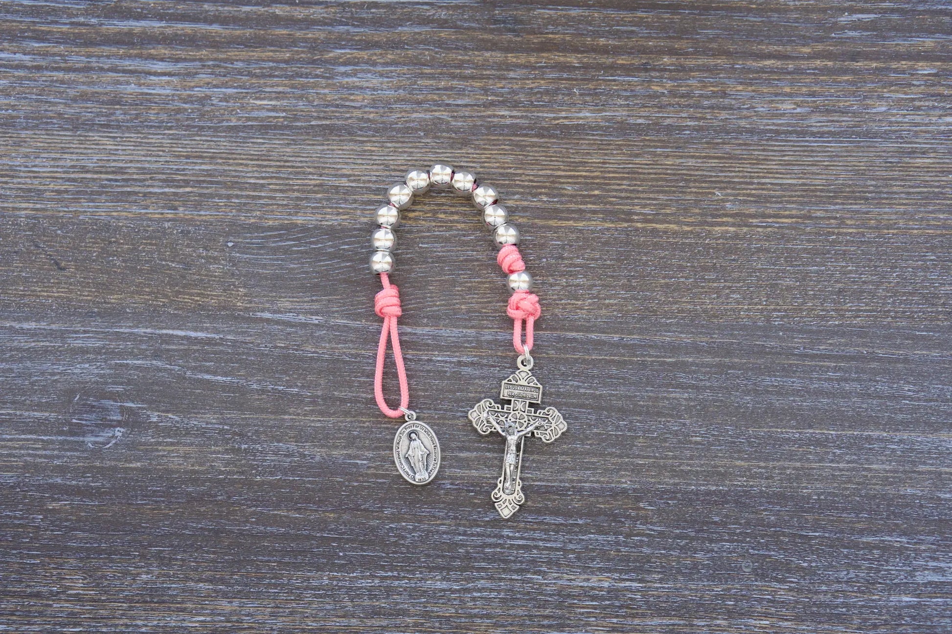 Divine Elegance premium metal paracord rosary with silver beads, crucifix, and medal in 4 colors.