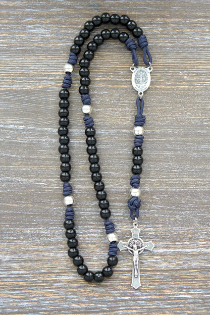 Black beaded metal paracord rosary with navy blue cord and silver crucifix.