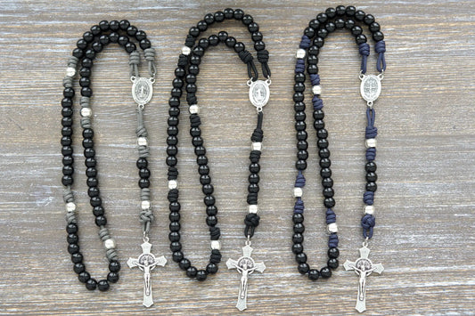 Three black beaded rosaries with silver Benedict Crucifix and centerpiece, available in three colors.