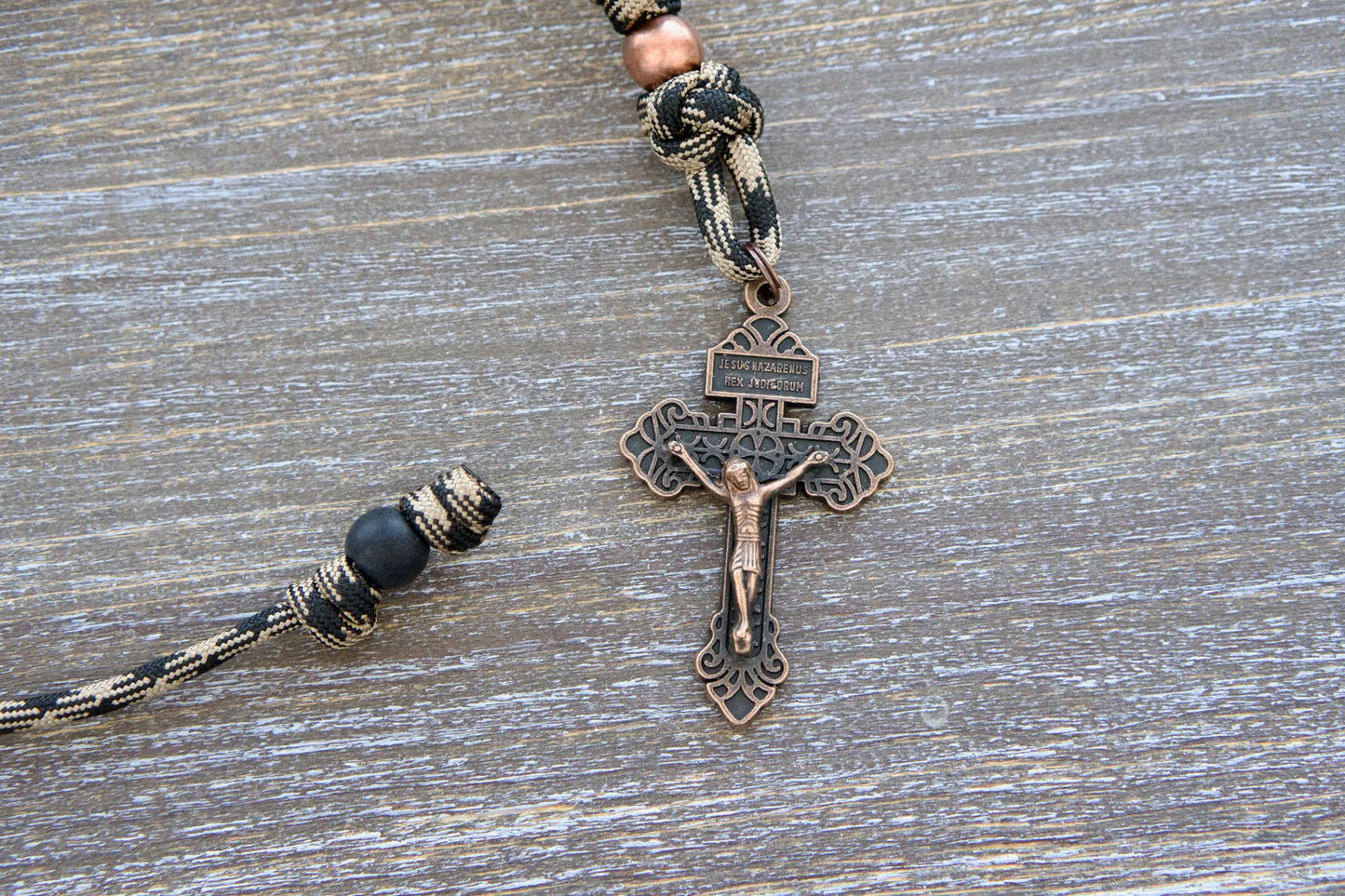 Heavy Duty Hail Mary mirror rosary, camo black and brown 550 paracord with matte black and antique copper beads sealed with a copper Pardon crucifix.