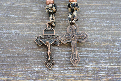 Heavy Duty Hail Mary rearview mirror rosary with camo black paracord, matte black beads, antique copper Our Father beads, and a copper Pardon crucifix.