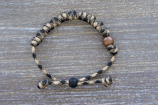 Heavy Duty Hail Mary rosary bracelet: black/brown camo paracord, 12mm and 10mm acrylic beads, adjustable, rugged and devout.