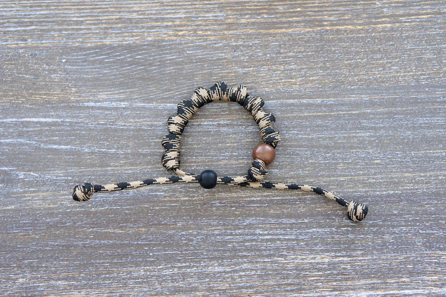 Heavy Duty Hail Mary bracelet: black/brown camo paracord, 12mm and 10mm beads, 10 knots for 10 Hail Mary prayers.