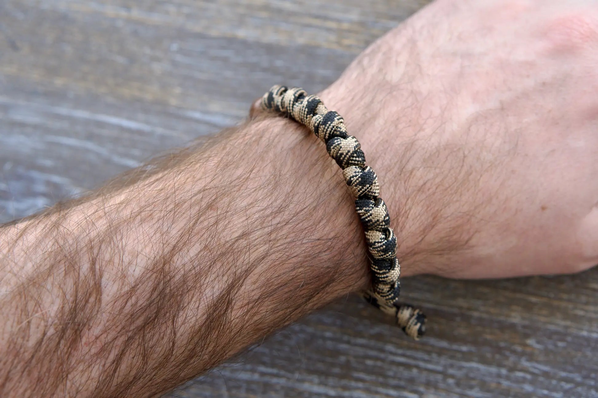 Heavy Duty Hail Mary rosary bracelet: black/brown camo paracord, 12mm and 10mm acrylic beads, secure knots for each Hail Mary prayer.