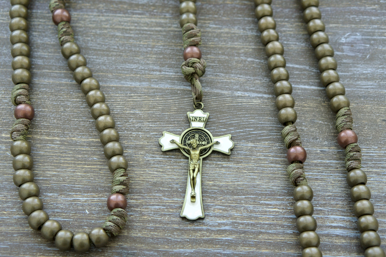 Premium camo paracord rosary - Holy Defense, a military-inspired Catholic gift for adults, featuring an antique copper Our Father bead, olive green Hail Mary beads, 1 inch St. Benedict medal, and a 3 inch enamel St. Benedict crucifix. Durable, unbreakable, and perfect for prayer on the go.