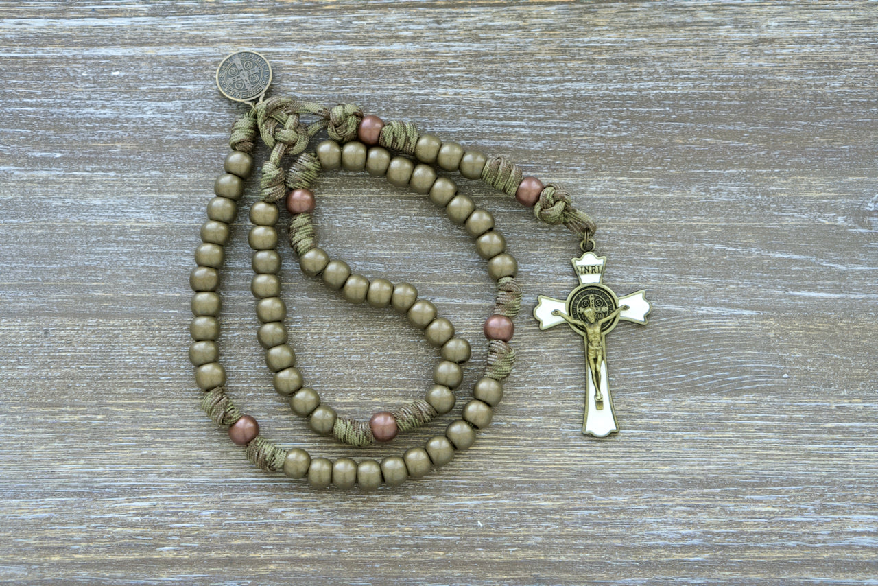 Holy Defense - 5 Decade Paracord Rosary, a premium, unbreakable Catholic gift featuring military-inspired design with durable camo paracord, antique copper Our Father beads, olive green Hail Mary beads, St. Benedict medal, and 3 inch enamel St. Benedict crucifix.