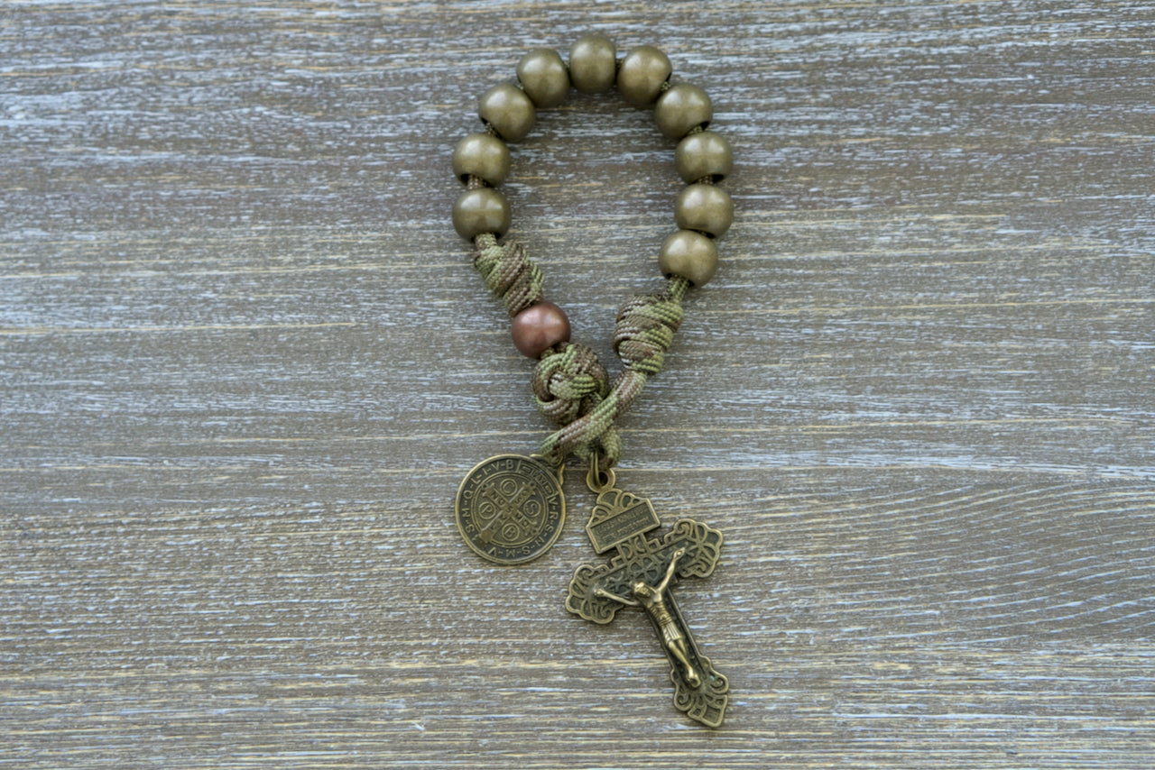 Holy Defense - Pocket Paracord Rosary: Military-inspired, durable camo paracord rosary with antique copper Our Father beads, olive green Hail Mary beads, St. Benedict medal, and pardon crucifix for spiritual support on-the-go.