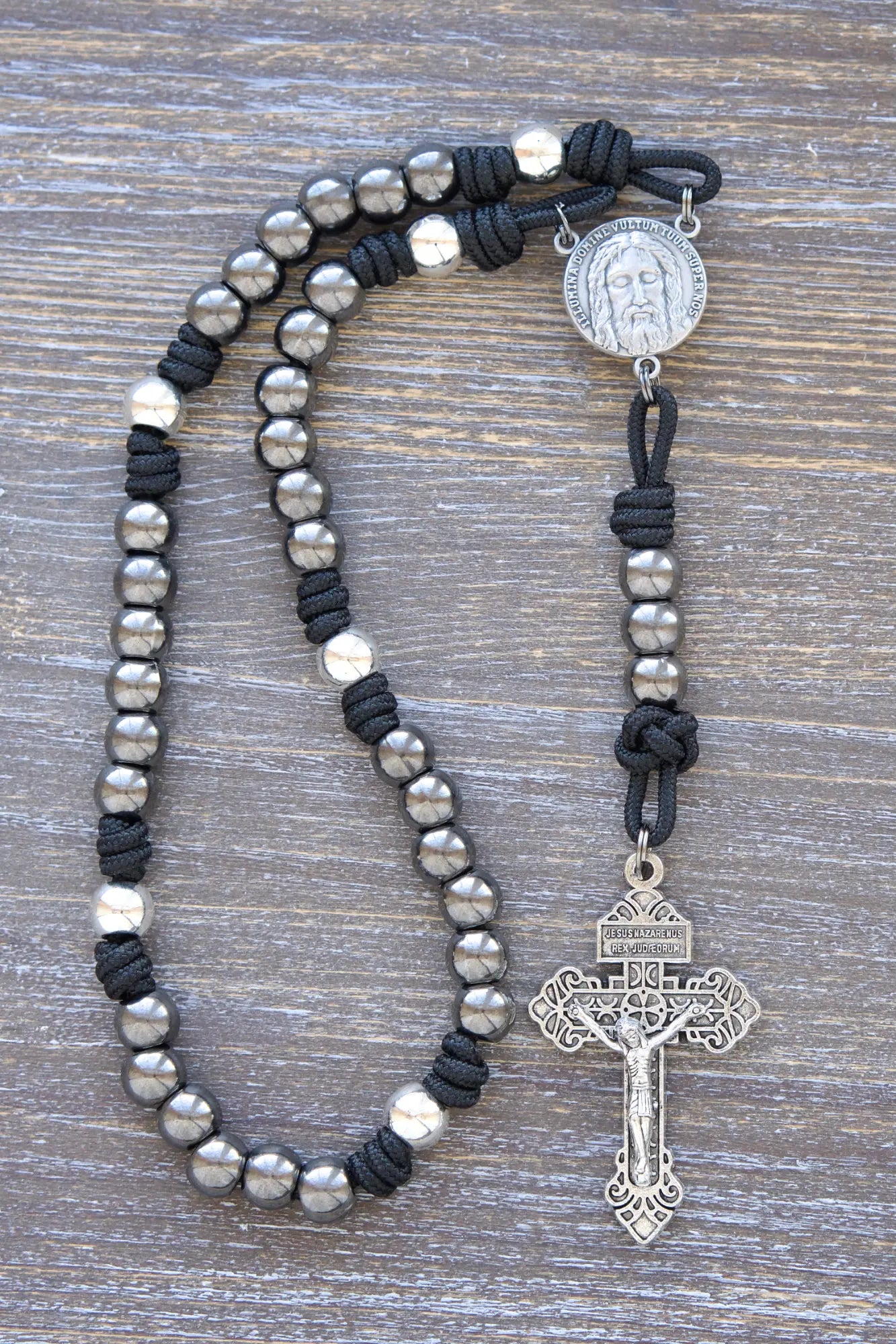 Holy Face Chaplet with paracord, metal beads, and "Illumina Domine Vultum Tuum Super Nos" centerpiece, 2-inch Pardon Crucifix, midnight black rope.
