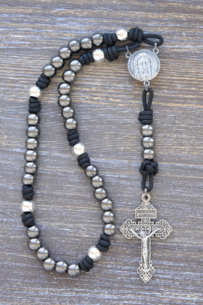 Holy Face Chaplet with paracord, metal beads, and "Illumina Domine Vultum Tuum Super Nos" centerpiece, 2-inch Pardon Crucifix, midnight black rope.