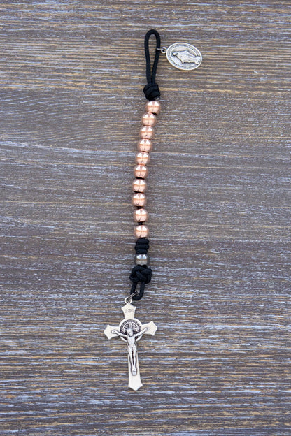 Immaculate Strength premium metal paracord rosary with black rope and rose gold beads, designed for strength and faith.