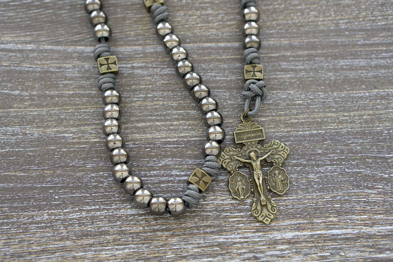 Iron Crusader rosary, handcrafted with grey paracord 275, olive crusader Our Father beads, gunmetal Hail Mary beads, a Miraculous Medal centerpiece, and a matching triple threat pardon crucifix.