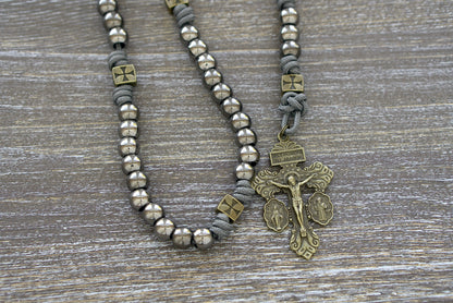 Iron Crusader rosary, handcrafted with grey paracord 275, olive crusader Our Father beads, gunmetal Hail Mary beads, a Miraculous Medal centerpiece, and a matching triple threat pardon crucifix.