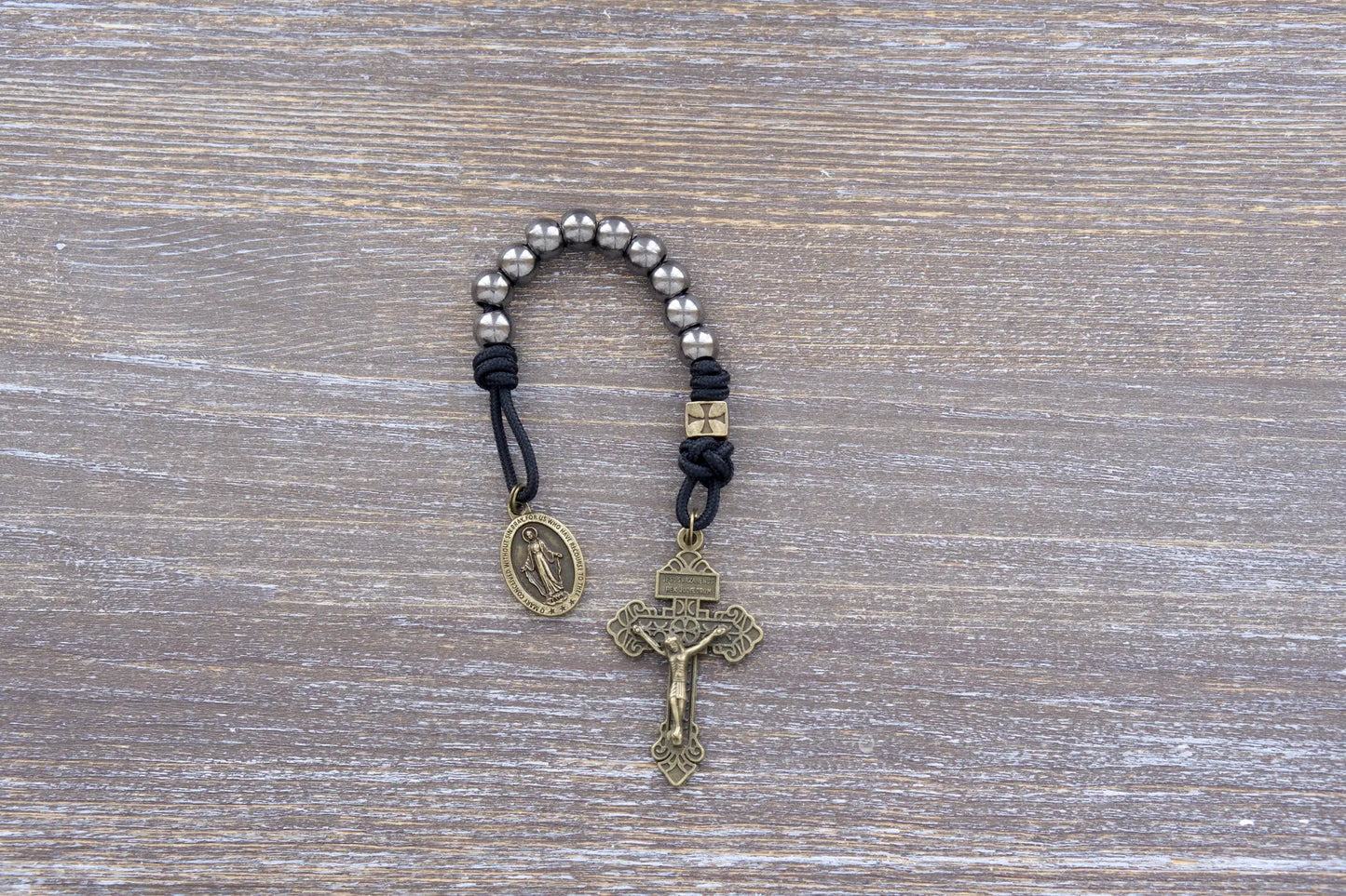 Iron Crusader pocket paracord rosary in midnight black, olive crucifix, metal beads, Miraculous Medal.