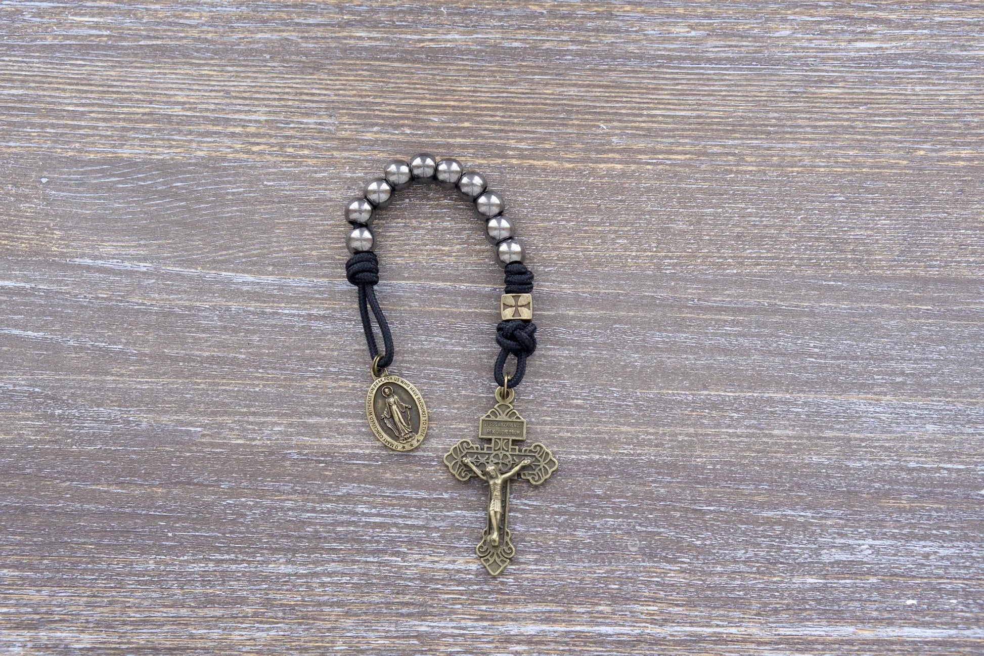 Iron Crusader pocket paracord rosary in midnight black, olive crucifix, metal beads, Miraculous Medal.