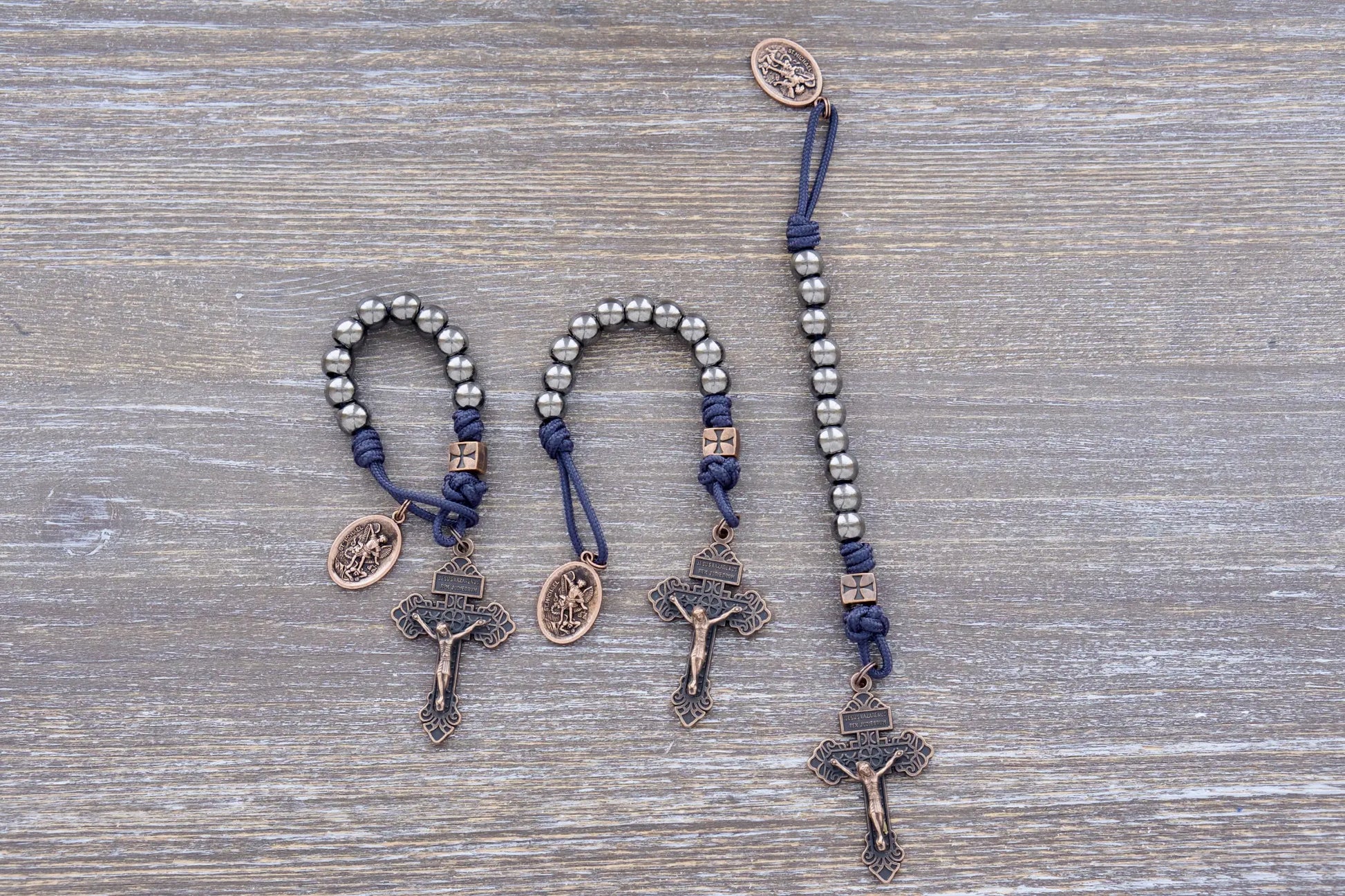 Iron Legion Premium Metal Paracord Rosary with copper crucifix and medal, navy or black rope, durable alloy beads.