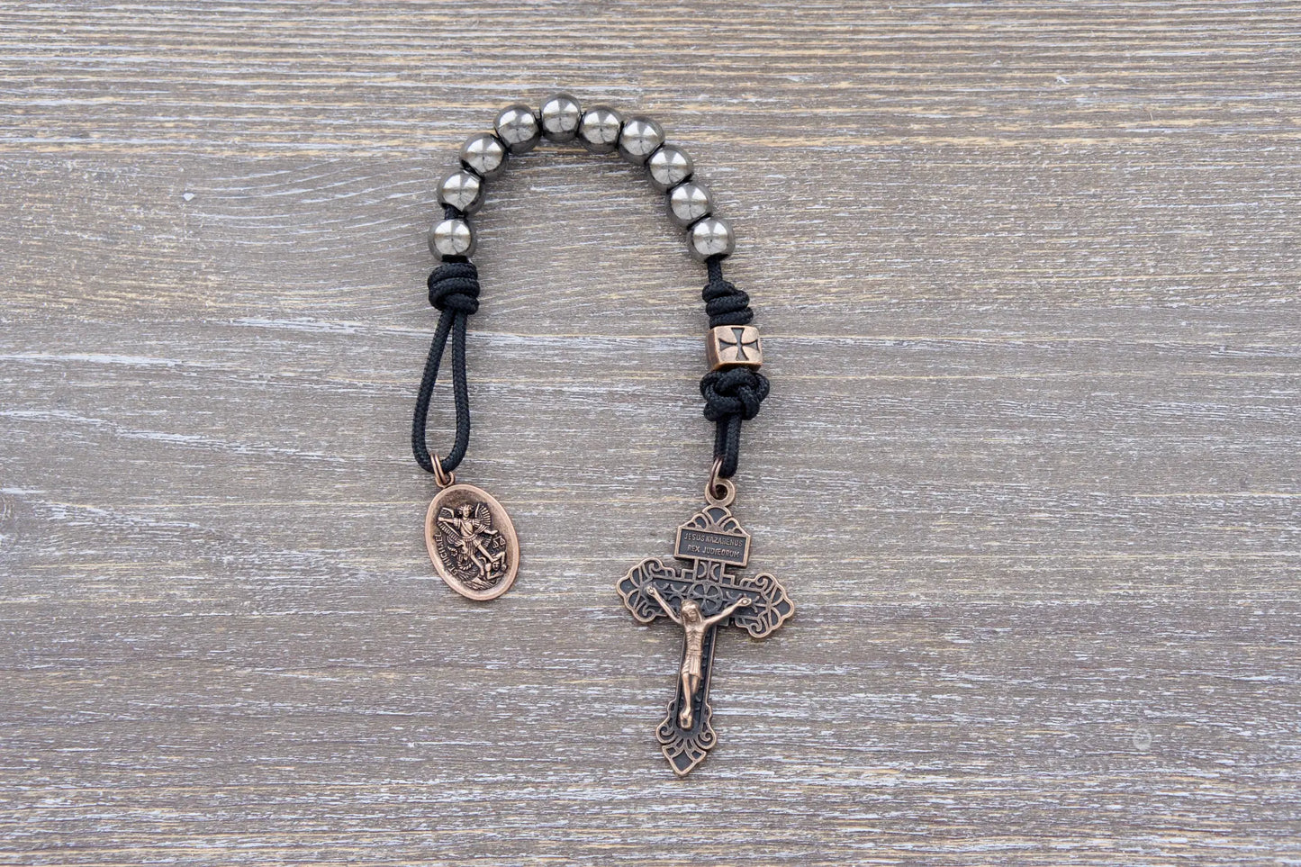 Iron Legion Premium Metal Paracord Rosary with copper crucifix and medal in navy or black rope.
