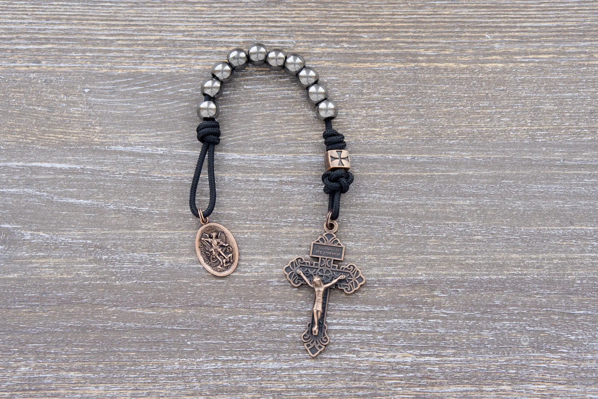 Iron Legion Premium Metal Paracord Rosary with copper crucifix and medal in navy or black rope.