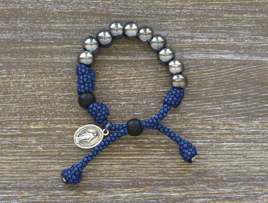 Blue and Gunmetal Kids' Rosary Bracelet by Sanctus Servo - Navy blue and gunmetal paracord with 10mm beads, Our Father bead, and Miraculous Medal for Catholic children.