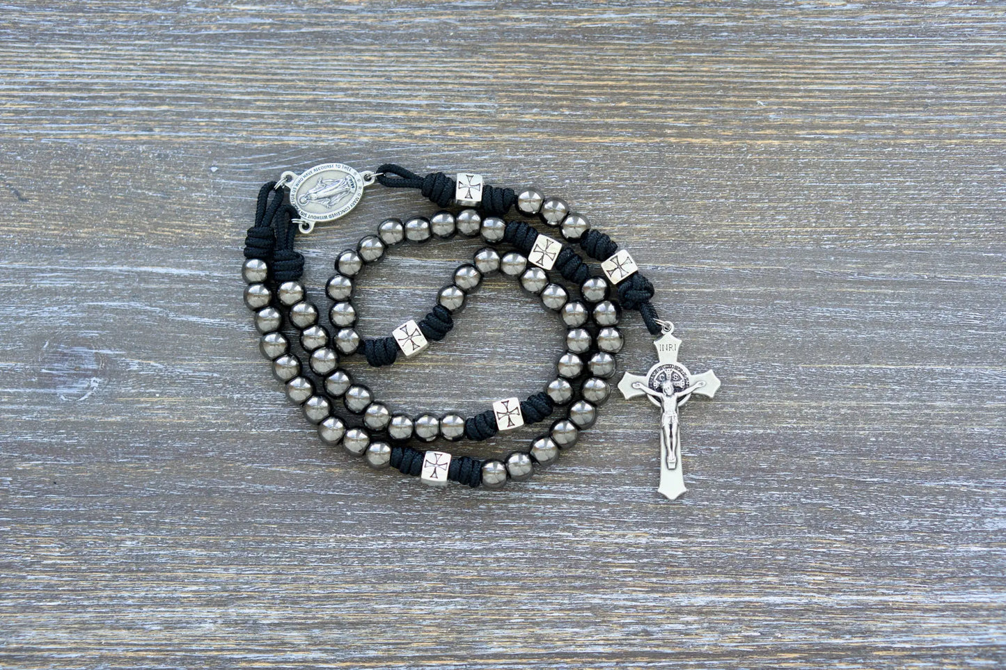 Last Stand Rosary: Gunmetal & silver beads, black paracord, St. Benedict crucifix, and Miraculous Medal centerpiece.