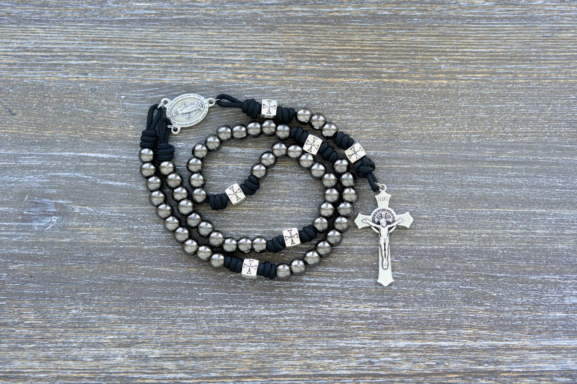 Last Stand Rosary: Gunmetal & silver beads, black paracord, St. Benedict crucifix, and Miraculous Medal centerpiece.