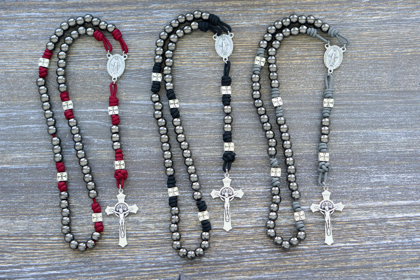 Last Stand Rosary: Gunmetal Hail Mary beads, silver crusader Our Father beads, red, black, gray paracord, and a St. Benedict crucifix.