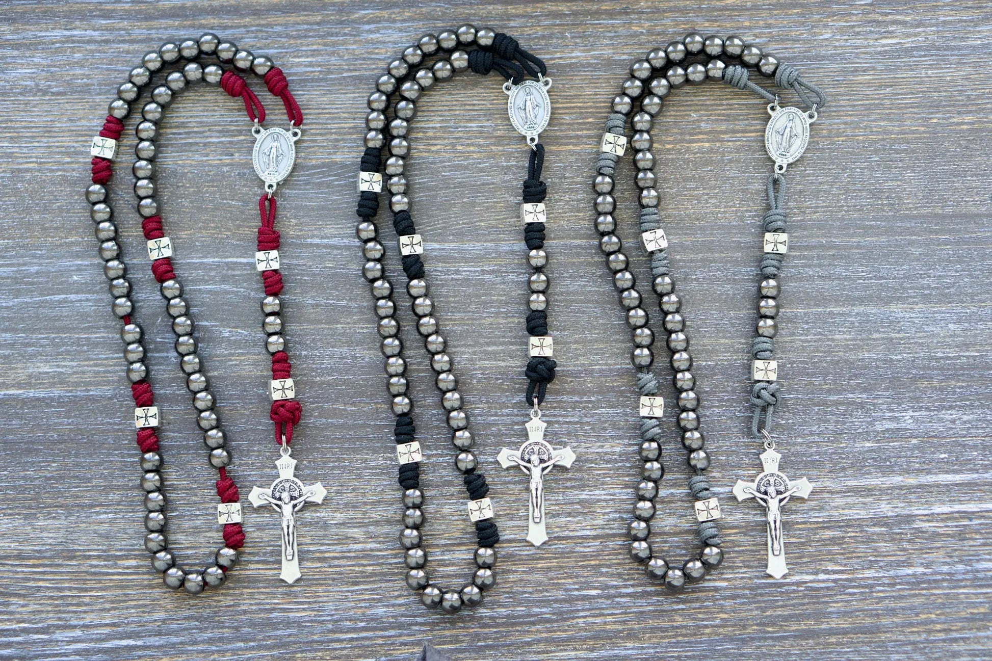 Last Stand Rosary: Gunmetal Hail Mary beads, silver crusader Our Father beads, red, black, gray paracord, and a St. Benedict crucifix.