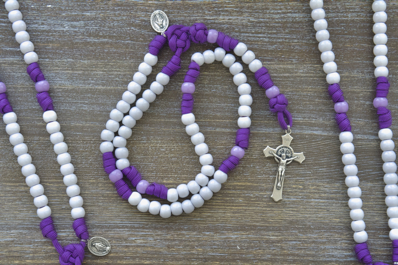 New 'Little Flowers of Jesus' Kid's Purple Paracord Rosary with White Hail Mary & Light Purple Our Father Beads, featuring a 2-inch St. Benedict Crucifix and a 0.75-inch Miraculous Medal - Perfect Catholic Gift for Kids.